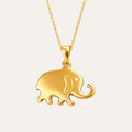 Gold elephant pendant on a chain against a white background